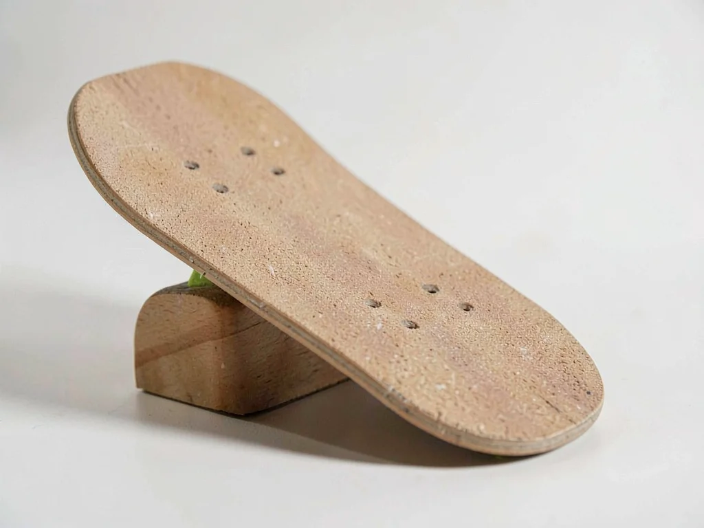 One classic skateboard deck rests grip-up showing rounded kick tails and a coars