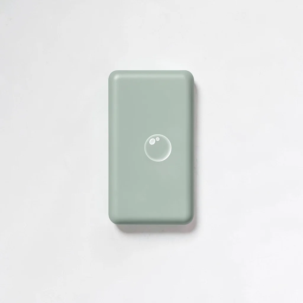 Flat-color vertical of a soap bar silhouette with a small bubble, sage and butte
