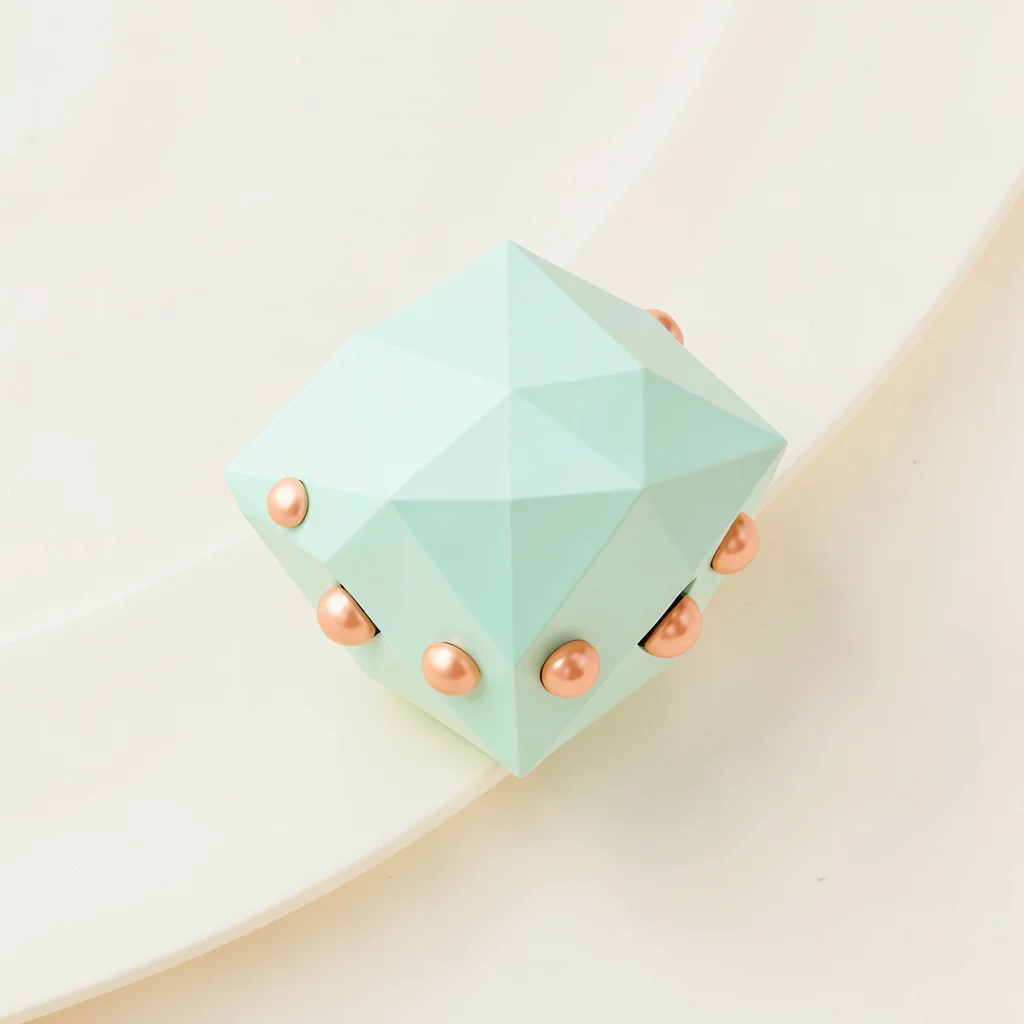 Jingly mint-green lowpoly tambourine with peach jingles and a chunky triangulate