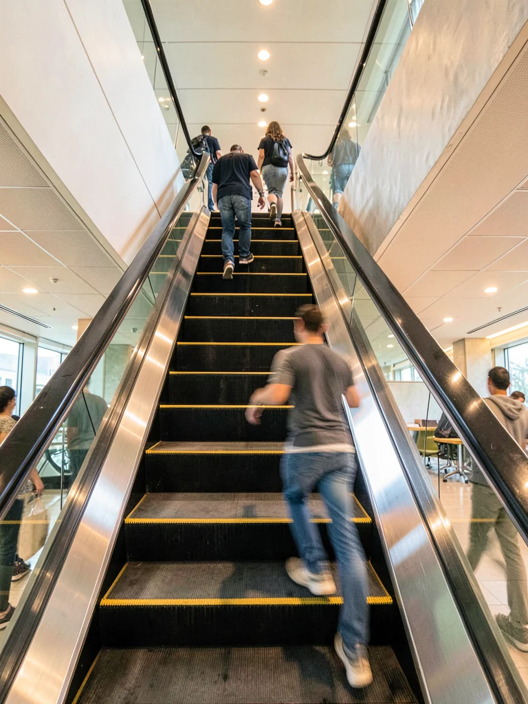 Morning escalator thirty-second exposure, ascending and descending streams of bl