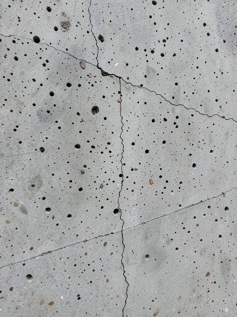 Precast concrete panel texture, perfectly uniform surface from factory mold, sub
