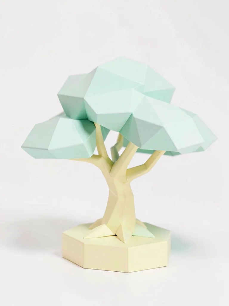 Miniature cream lowpoly bonsai tree with a butter-yellow trunk and faceted mint 
