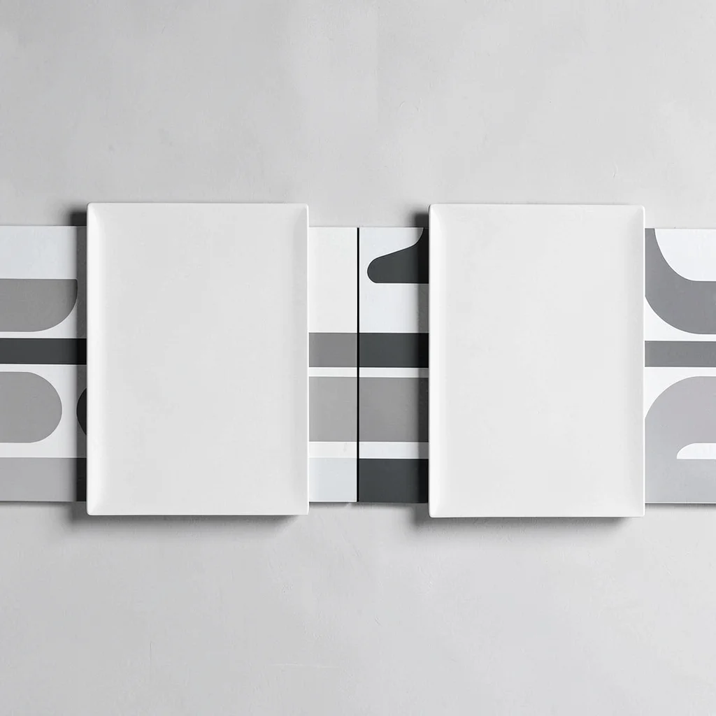 Side-by-side pair of two agenda plates separated by a hairline seam, abstract ro