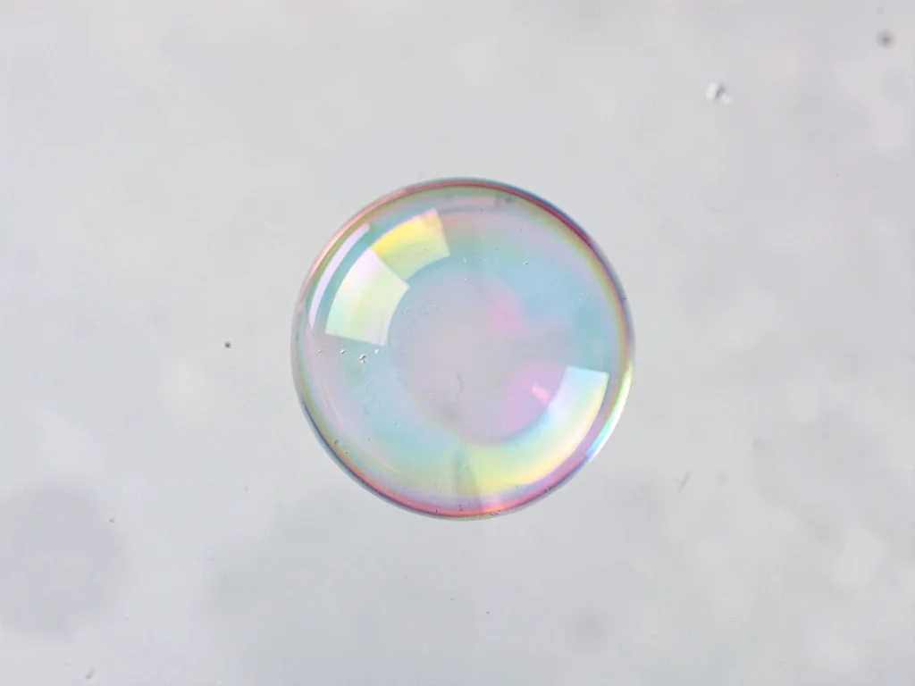 Single perfect sphere on film surface