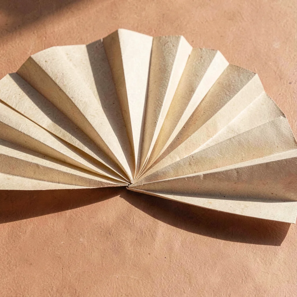 Vector fan of paper-like wedges spreading horizontally, sun-baked terracotta and