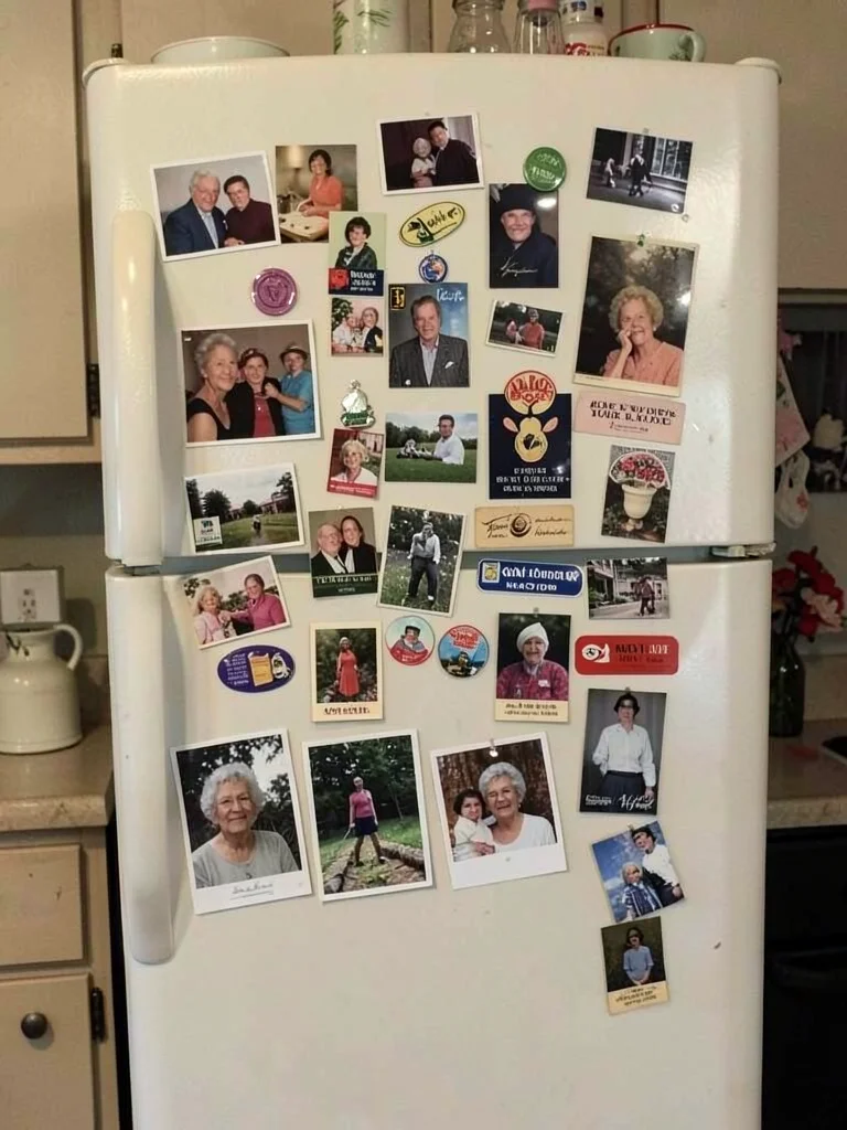 Grandmother's refrigerator door, fifty years of magnets and photos and coupons a