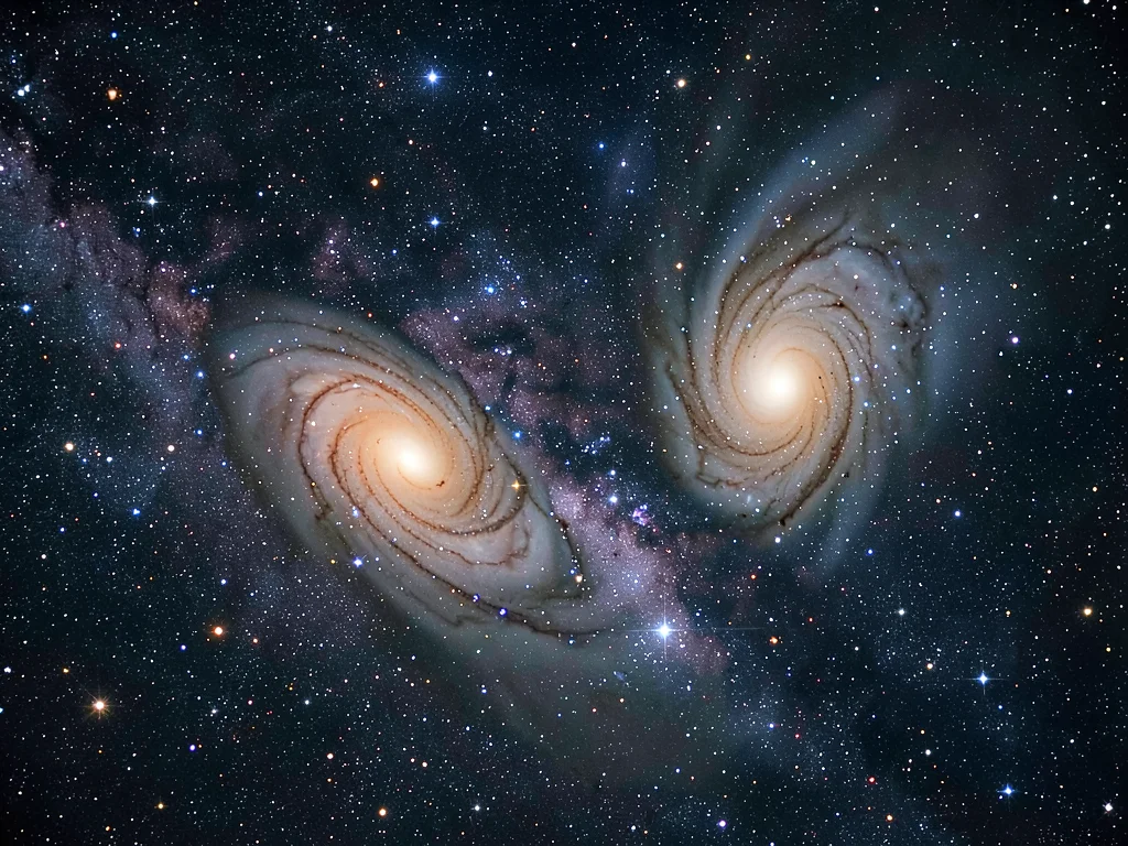 A two-galaxy interaction — two spiral galaxies distorting each other with tidal 