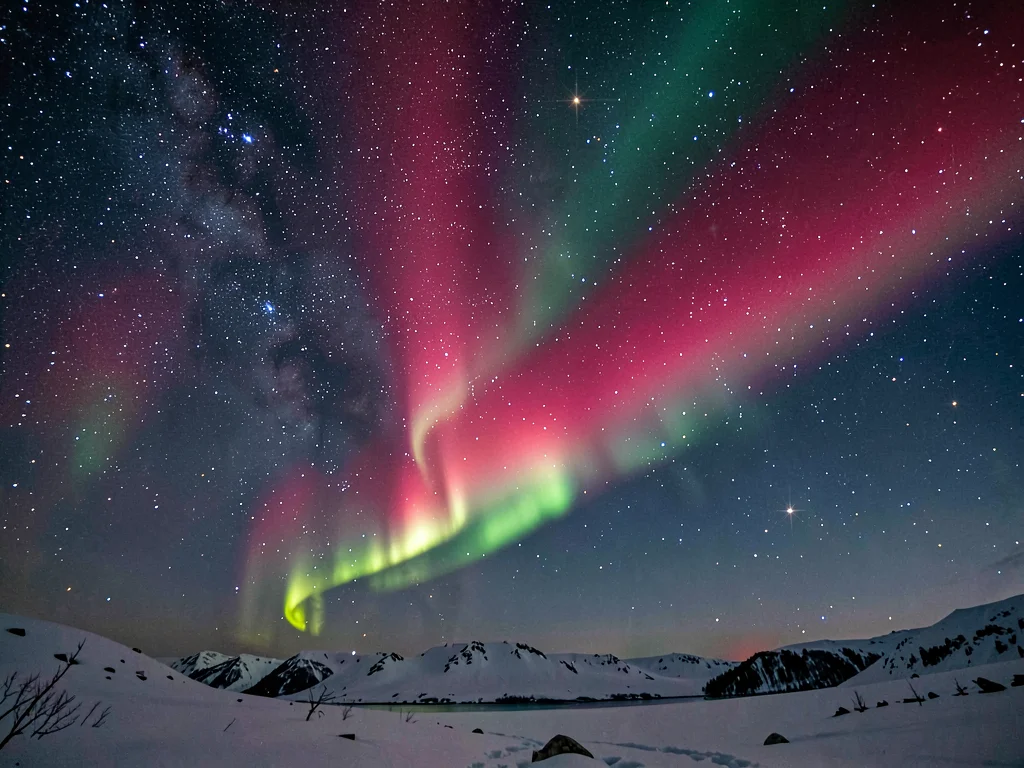 Rare red aurora at high altitude against stars