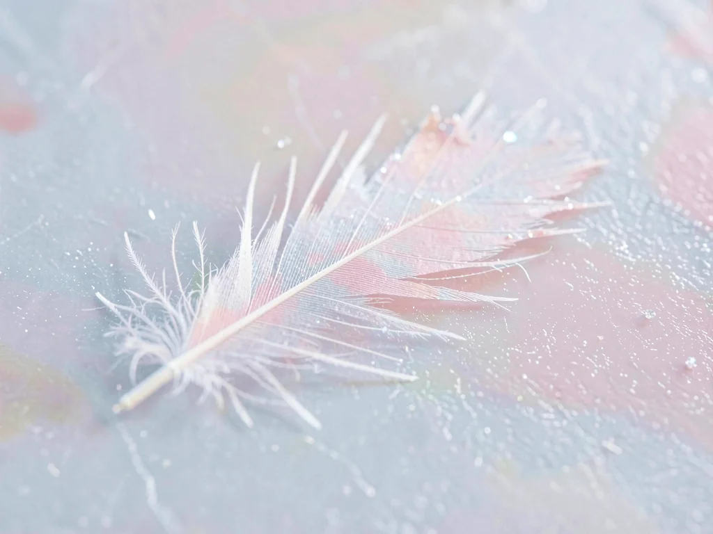 Ice-feather plume sprawling diagonally across a 4cm patch of pale ice, its quill