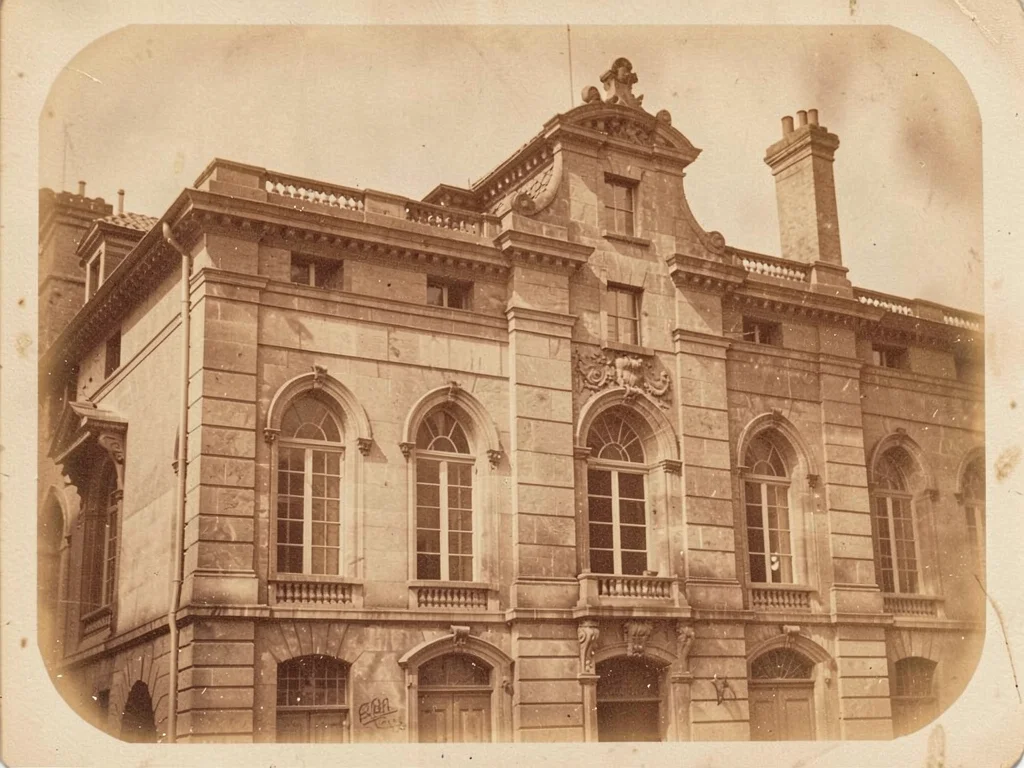 A Victorian architectural study — stone facade with arched windows, warm sepia t