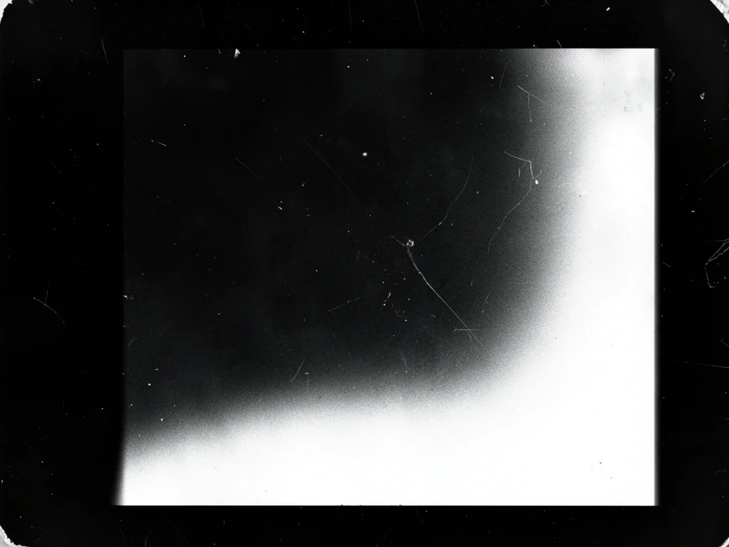 A print with deliberate light fogging: a smooth gradient of exposure from one ed