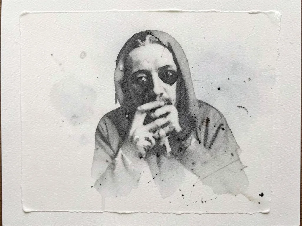 Ghost print from second pull, residual ink creating pale shadow of the original 