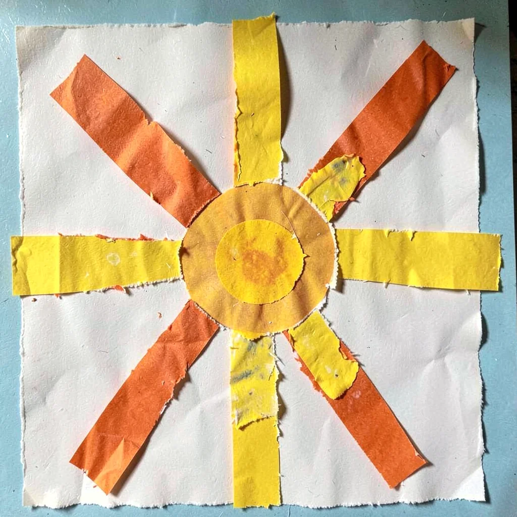 Paper collage sun with tissue rays