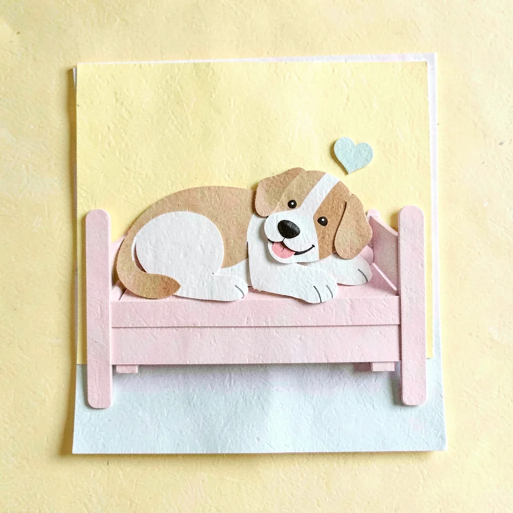 Cut-paper collage of a happy dog napping on a cute wooden bed, sunny yellow back