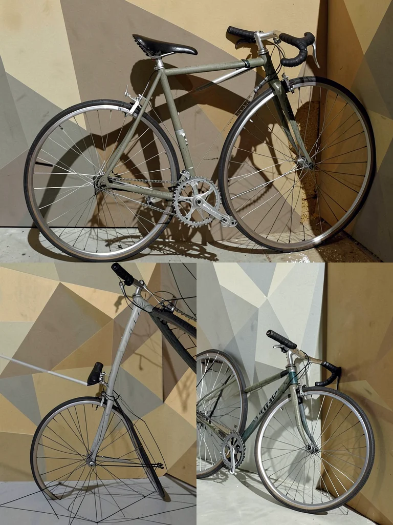 Bicycle leaning against a wall — wheel spokes, handlebars, frame each seen from 