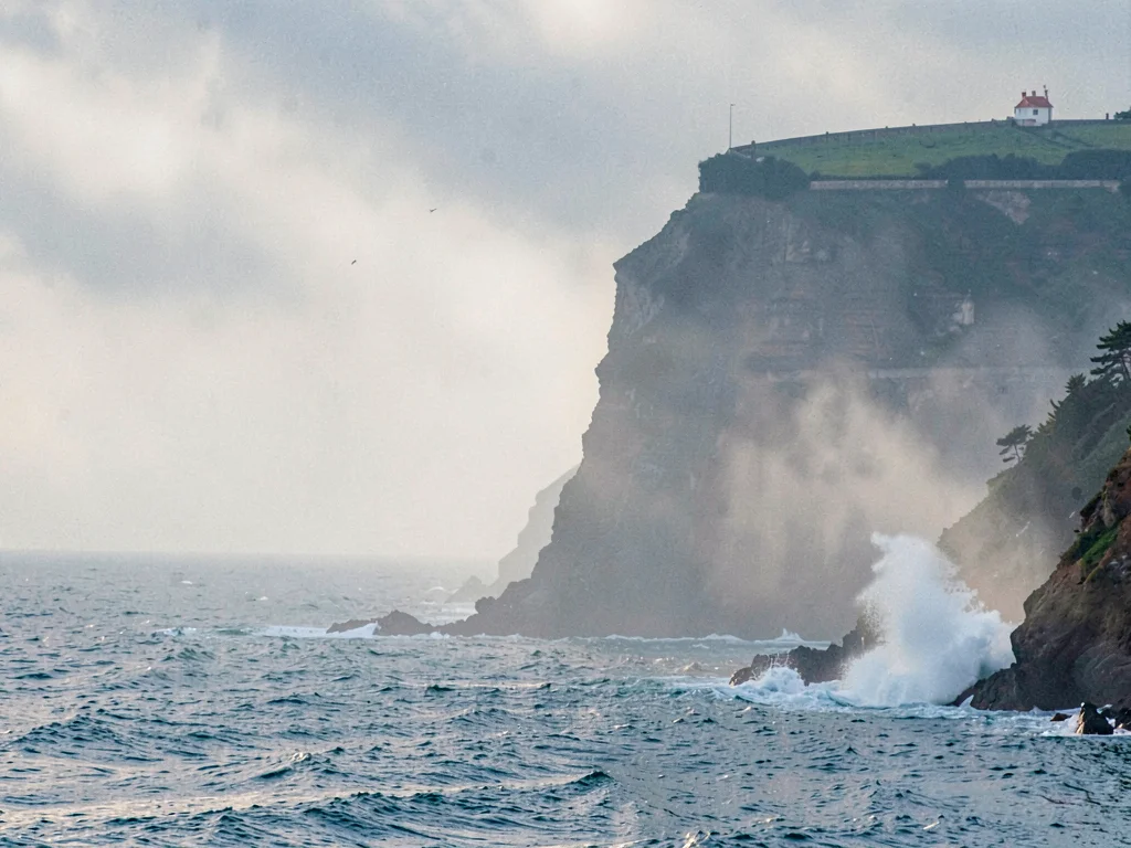 Distant headland through spray haze