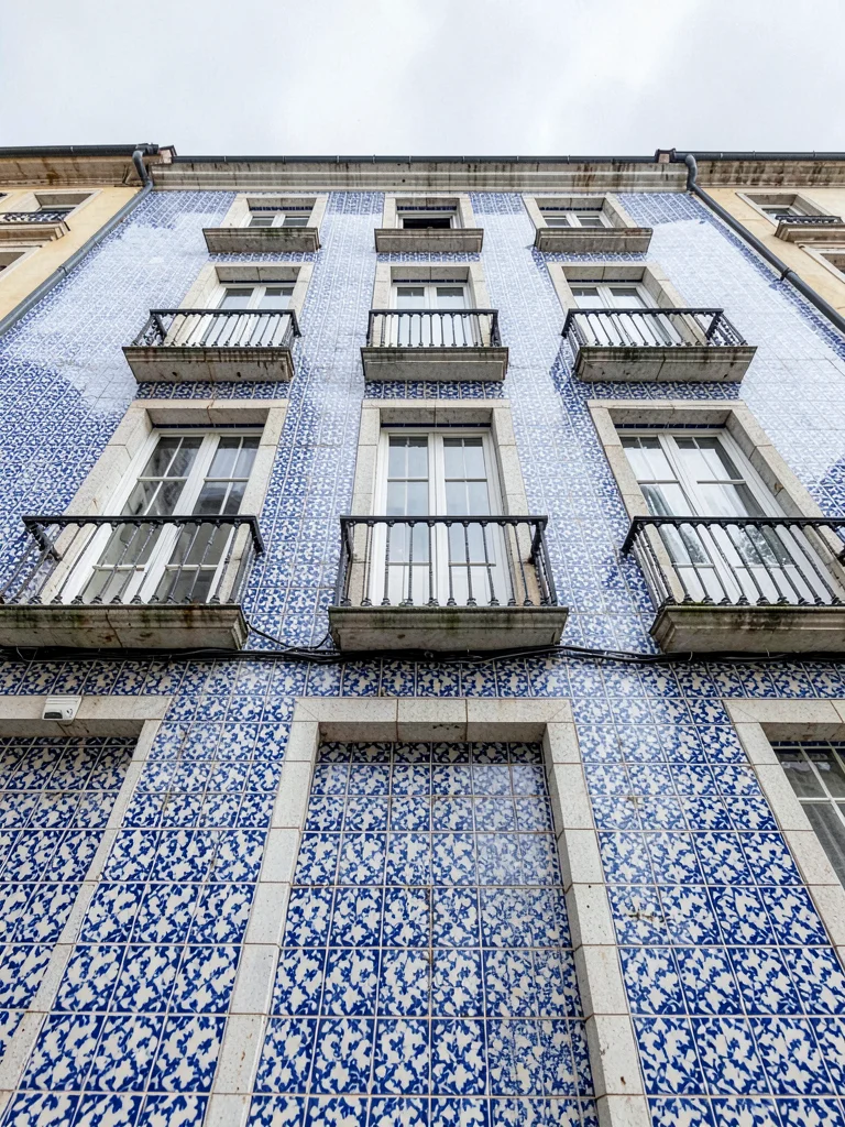 Street-Level Upward View — Full Tiled Facade