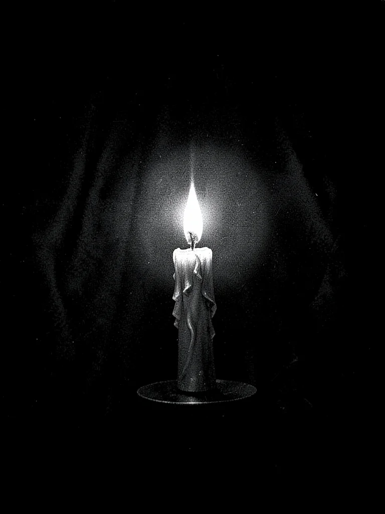 Candle in darkness