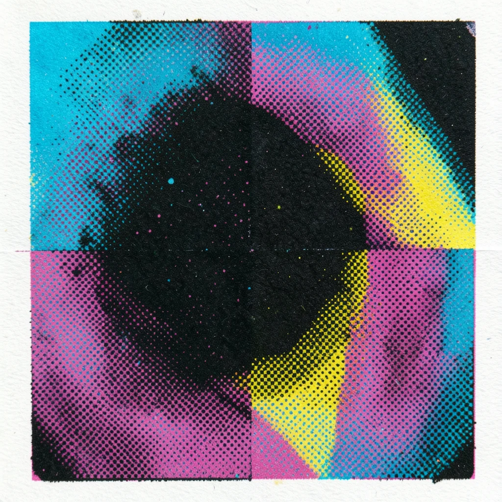 Close-up of CMYK overprint where all four colors overlap, dense near-black area 
