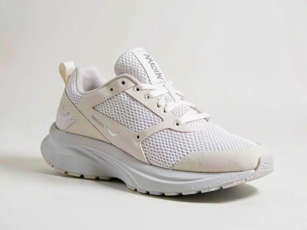 The classic running shoe rests at three-quarter angle showing mesh upper and a c