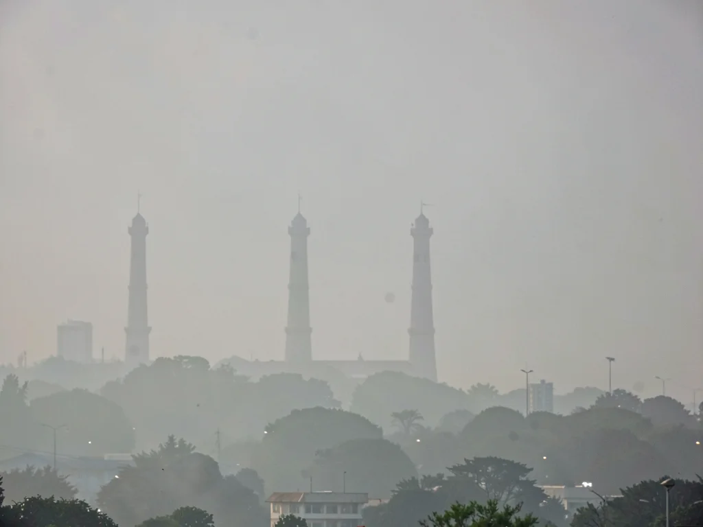 Distant towers fading into smog