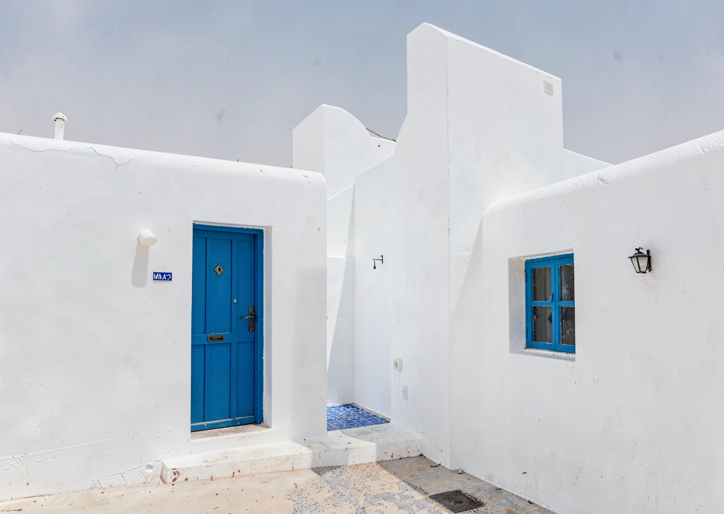 Extreme minimalist restraint of Muscat, Oman, whitewashed fishing village with s