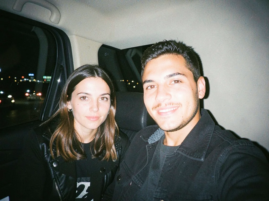 Taxi backseat with city lights through window