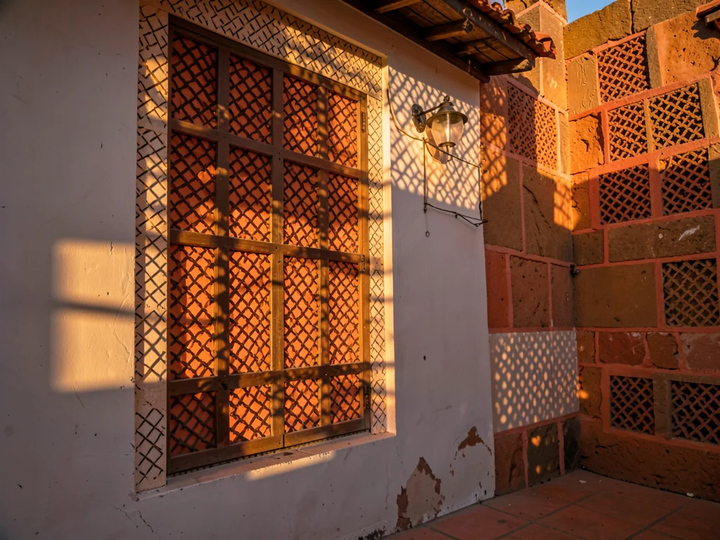 Afternoon sun through mashrabiya lattice in Lamu, Kenya, Evening light through l